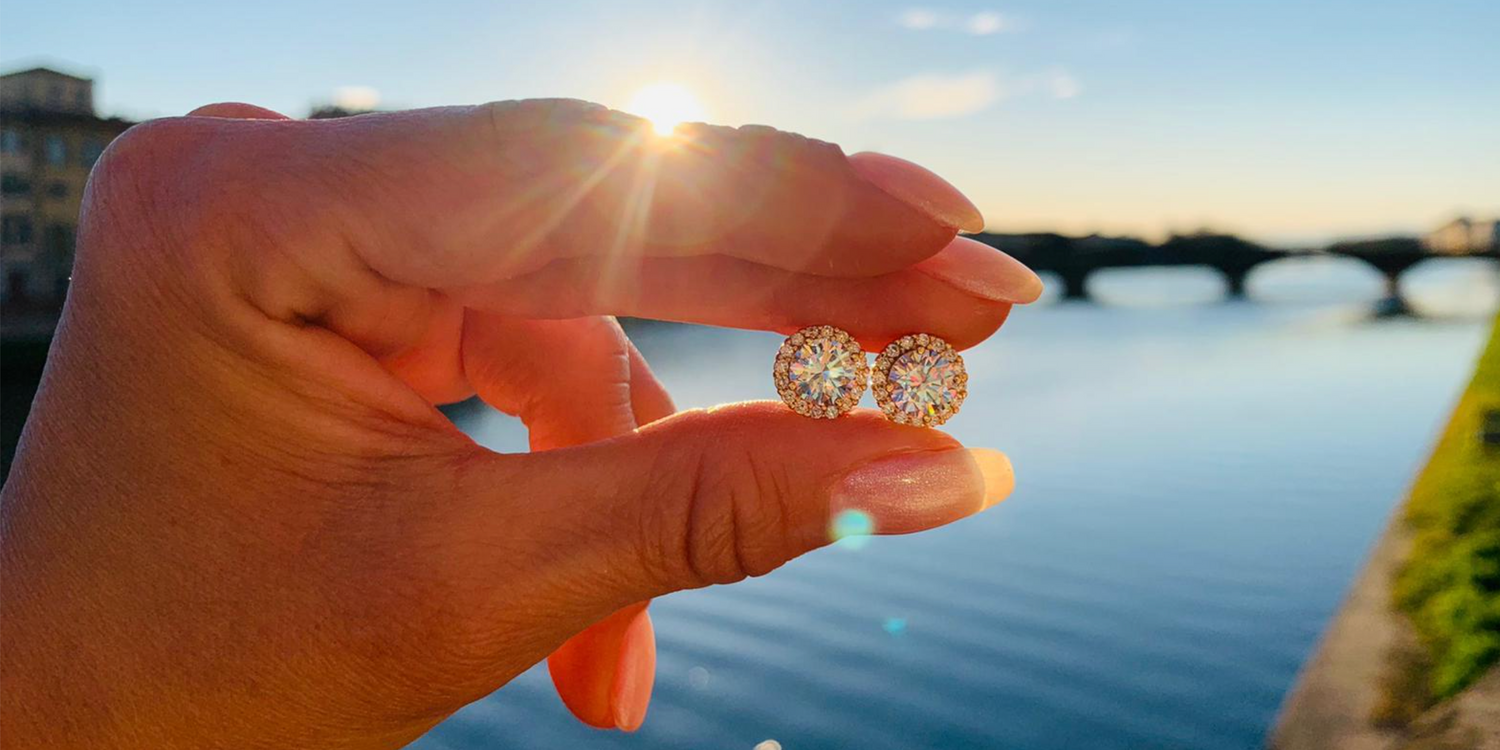 Round earrings with stones in the sun